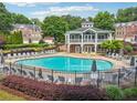 Beautiful community pool with plenty of lounge chairs and a clubhouse perfect for relaxation on a sunny day at 3505 Chattahoochee Summit Se Ln # 25, Atlanta, GA 30339