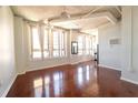 Spacious living room featuring hardwood floors, high ceilings, and views into the kitchen at 20 Marietta St. Nw #12D, Atlanta, GA 30303