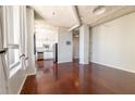 Hardwood floors flow through the open floor plan into the kitchen with stainless appliances at 20 Marietta St. Nw #12D, Atlanta, GA 30303