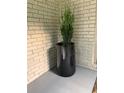 Front porch featuring a large, sleek, black flower pot at 3629 Embry Cir, Atlanta, GA 30341