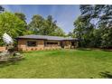 Beautifully landscaped front yard with a brick home and green grass, offering a suburban aesthetic at 639 W Ponce De Leon Ave, Decatur, GA 30030