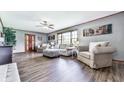 Comfortable living room features wood trim, neutral decor, and wood-look floors at 72 Hazelwood Nw Rd, Cartersville, GA 30121