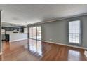 Open concept living space featuring sleek hardwood floors and natural light at 5554 Clover Rise Ln, Norcross, GA 30093