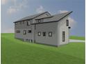 A rear view of a modern two-story home showing a daylight basement and a sloped yard at 246 Garland Ave, Decatur, GA 30030