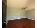 A spacious living room features a ceiling fan and dark laminate flooring at 4416 Arcadia Dr, Norcross, GA 30093