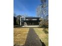 Spacious backyard with a patio and a walkway made of black mulch at 1921 Herbert Dr, Tucker, GA 30084