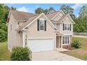Charming two-story home with neutral siding, black shutters, and a two-car garage at 4405 Feather Way, Douglasville, GA 30135