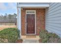 Close-up of the front door with brick surround and welcoming landscaping at 137 Centennial Ridge Dr, Acworth, GA 30102