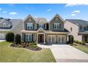 Beautiful two-story home with a manicured lawn, a two-car garage and inviting front yard landscaping at 3883 Wakefield Hall Se Sq, Smyrna, GA 30080