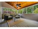 Cozy screened-in patio with comfortable seating, perfect for relaxation at 4047 Jordan Lake Dr, Marietta, GA 30062
