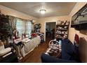 A cozy living room with nice wood floors and large window letting in tons of natural light at 944 Stallings Se Ave, Atlanta, GA 30316