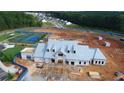 Aerial view of the construction of a community center featuring a tennis court and clubhouse at 301 Sobeck Way, Canton, GA 30115