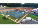 Aerial view of finished neighborhood tennis courts with manicured landscaping and convenient walkway access at 301 Sobeck Way, Canton, GA 30115