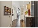 Inviting hallway features hardwood floors, art, and elegant decor at 2660 Peachtree Nw Rd # 4G, Atlanta, GA 30305