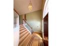 Bright foyer with hardwood floors, a staircase, and natural light from the large front window at 4003 Preston Place Ln, Powder Springs, GA 30127