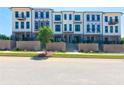 New townhomes with modern architecture, featuring brick accents and individual balconies at 118 Iveybrooke Ln # 64, Alpharetta, GA 30009