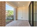 Covered patio with brick flooring and view of the yard at 118 Iveybrooke Ln # 64, Alpharetta, GA 30009