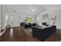 Bright living room featuring hardwood floors, a fireplace, and vaulted ceilings at 2990 Williams Farm Dr, Dacula, GA 30019