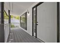 Inviting front porch with modern railings and a view of the neighborhood at 2990 Williams Farm Dr, Dacula, GA 30019