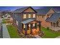 Beautiful two-story home with a inviting front porch, wood accents and well-maintained lawn at 701 Smith St, Atlanta, GA 30310