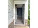 Inviting entryway with a modern door, stylish flooring, and neutral walls, creating a welcoming atmosphere at 235 Centennial Cir, Canton, GA 30114
