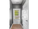 Open entryway with wood floors and view to the exterior at 235 Centennial Cir, Canton, GA 30114