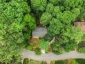 Aerial view of a house nestled among many tall green trees at 2361 Woodward Nw Way, Atlanta, GA 30305