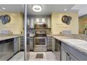 Stylish kitchen featuring stainless steel appliances, granite countertops, and grey cabinets at 375 Ralph Mcgill Blvd # 1503, Atlanta, GA 30312
