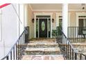 Inviting front entrance with a stone walkway, elegant front door, and charming architectural details at 436 Westlake Nw Dr, Marietta, GA 30064
