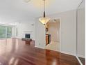 Bright living room featuring hardwood floors, fireplace, and a large sliding glass door leading to a balcony at 2308 Country Park Se Dr, Smyrna, GA 30080