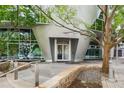Modern building entrance with unique architecture, landscaping and accessible ramp at 3338 Peachtree Ne Rd # 1010, Atlanta, GA 30326