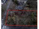 Aerial view of a property, partially obscured by trees, with red boundary lines at 698 Bellemeade Nw Ave, Atlanta, GA 30318