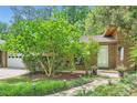 Brick home with manicured landscaping, stone walkway, and a lush lawn at 2687 Goodfellows Rd, Tucker, GA 30084