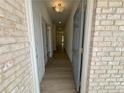 View of the hallway featuring a neutral color palette with hard wood floors, and recessed lighting at 5383 Heron Bay Blvd, Locust Grove, GA 30248