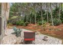 Serene patio with seating and a view of the wooded backyard at 6355 Marlow Dr, Cumming, GA 30041