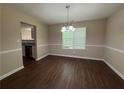 Dining room showcasing modern light fixture and hardwood flooring at 99 Ashtonbrook Dr, Mcdonough, GA 30252