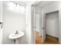 Bathroom featuring a pedestal sink, and doorway that goes to a walk in closet at 406 Vinings Forest Se Cir, Smyrna, GA 30080