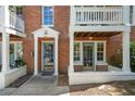 Charming entrance of a brick townhouse with blue doors and inviting architecture at 974 Greenwood Ne Ave # 6, Atlanta, GA 30306