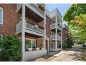 Brick townhouse with multi-level balconies, offering a unique outdoor living space at 974 Greenwood Ne Ave # 6, Atlanta, GA 30306