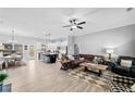 Spacious living room featuring an open concept layout with modern furnishings and ample natural light at 104 Federal Path, Temple, GA 30179