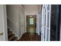 Inviting entryway with hardwood floors and staircase at 1780 Spring Hill Cv, Lithonia, GA 30058