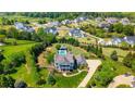 Sprawling property featuring a private pool, manicured grounds, and a picturesque neighborhood setting at 210 Tifton Ln, Roswell, GA 30075