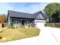 Attractive single Gathering home with a lush lawn and well maintained landscaping at 2710 Sandy Irwin Sw Ct, Marietta, GA 30064