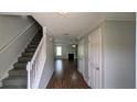 Inviting entryway featuring hardwood floors, stairs to the upper level, and access to the living area at 3104 Leyland Ct, Decatur, GA 30034