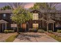 Charming brick townhome with a well-manicured front yard and ample parking space at 3149 Kingswood Gln, Decatur, GA 30034