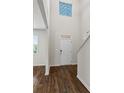 Entryway with hardwood floors and white front door provides access to living area at 3573 Stonebranch Ln, Loganville, GA 30052