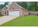 One-story home featuring a well-maintained lawn and an attached two-car garage at 4535 Clipper Bay Rd, Duluth, GA 30096