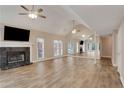 Spacious living room with hardwood floors, a fireplace, and a mirrored wall at 4535 Clipper Bay Rd, Duluth, GA 30096
