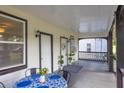 Inviting porch with table and chairs, enhancing outdoor enjoyment and relaxation at 11 Poplar St, Porterdale, GA 30014