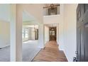 Grand foyer with soaring ceilings, hardwood floors, and an open view to the living spaces at 23 Dynasty Dr, Fairburn, GA 30213